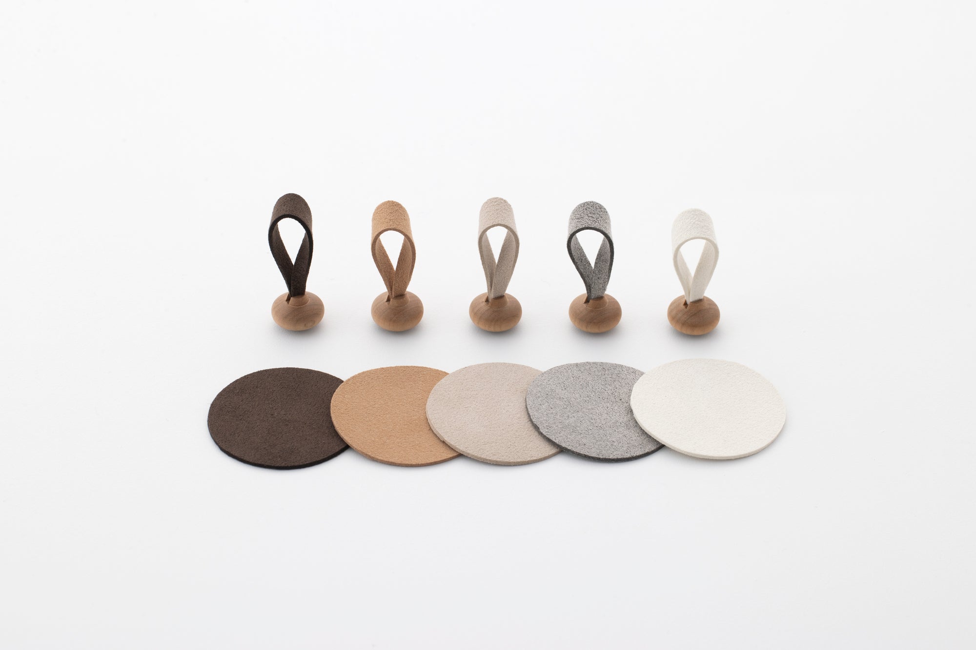 Five color variations of mallets and mats for Tailo pet memorial bell: Chocolate, Tan, Cream, Mixed Gray, and White