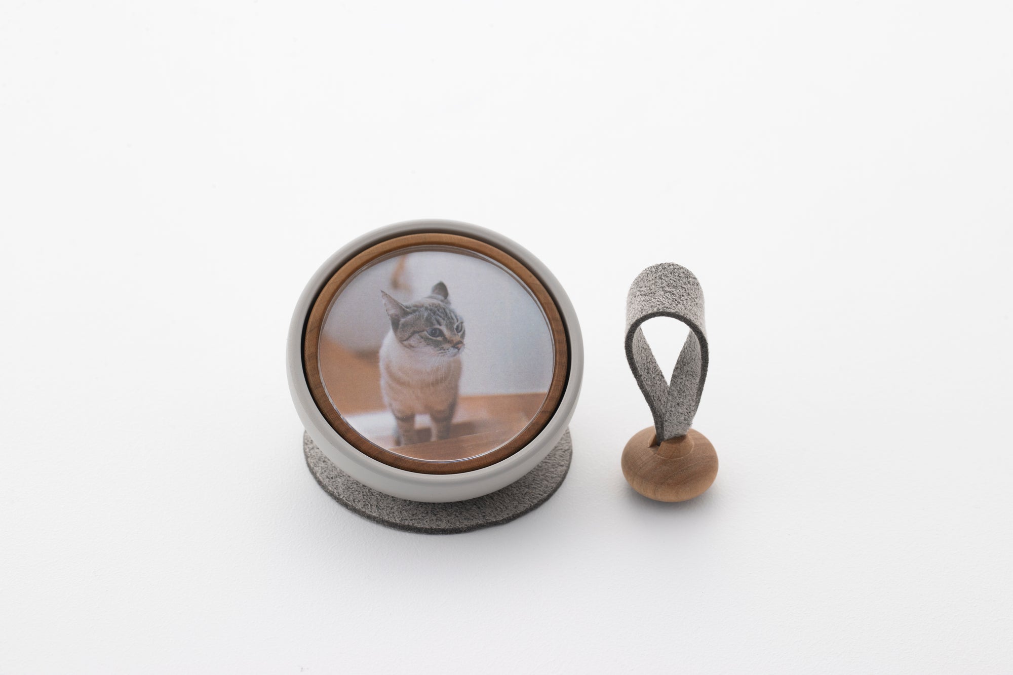 Tailo pet memorial bell in Mixed Gray designed for modern interiors