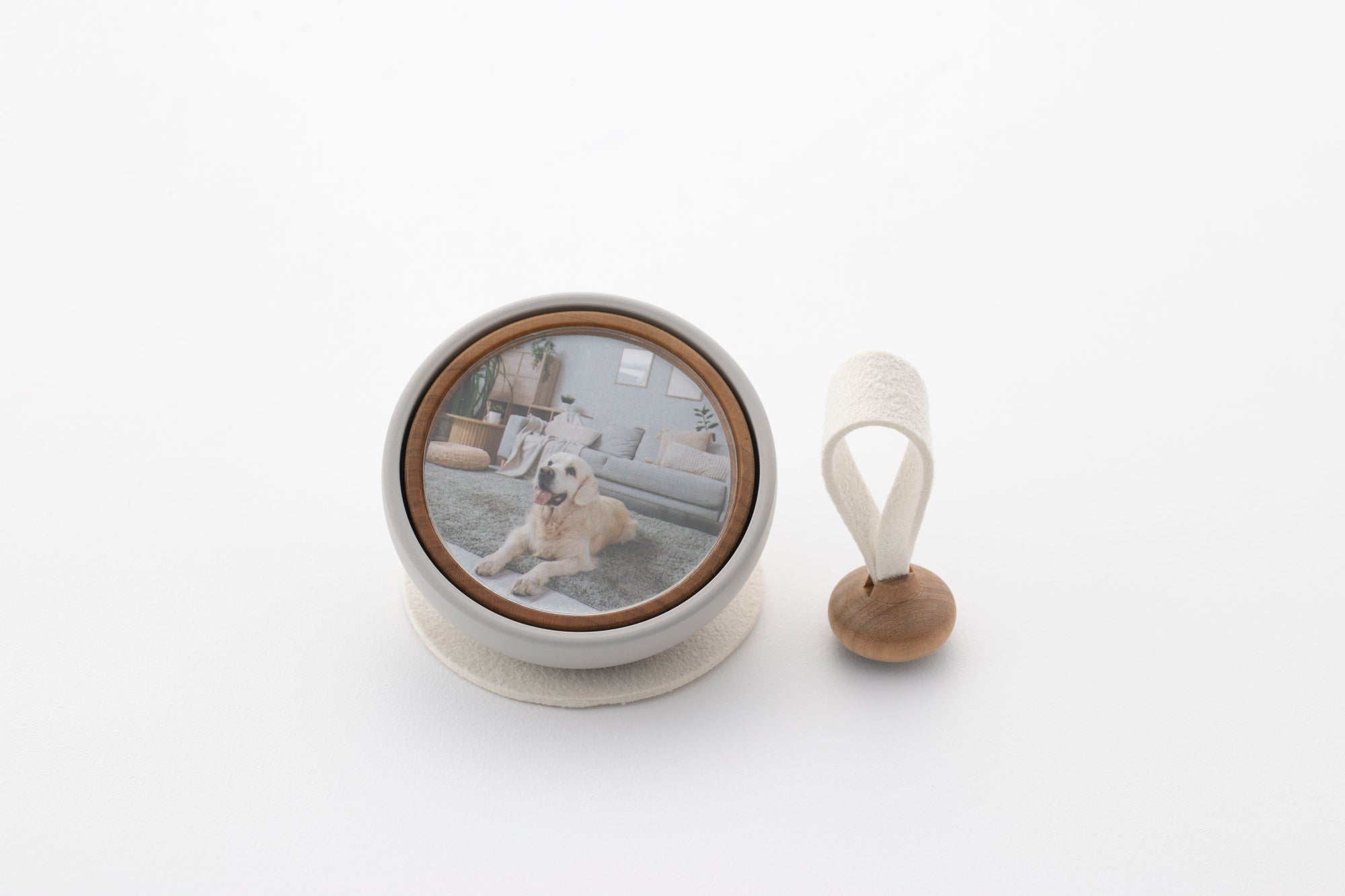 Tailo pet memorial bell in White with a photo of a dog and swaying mallet
