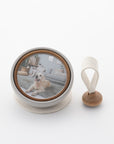 Tailo pet memorial bell in White with a photo of a dog and swaying mallet