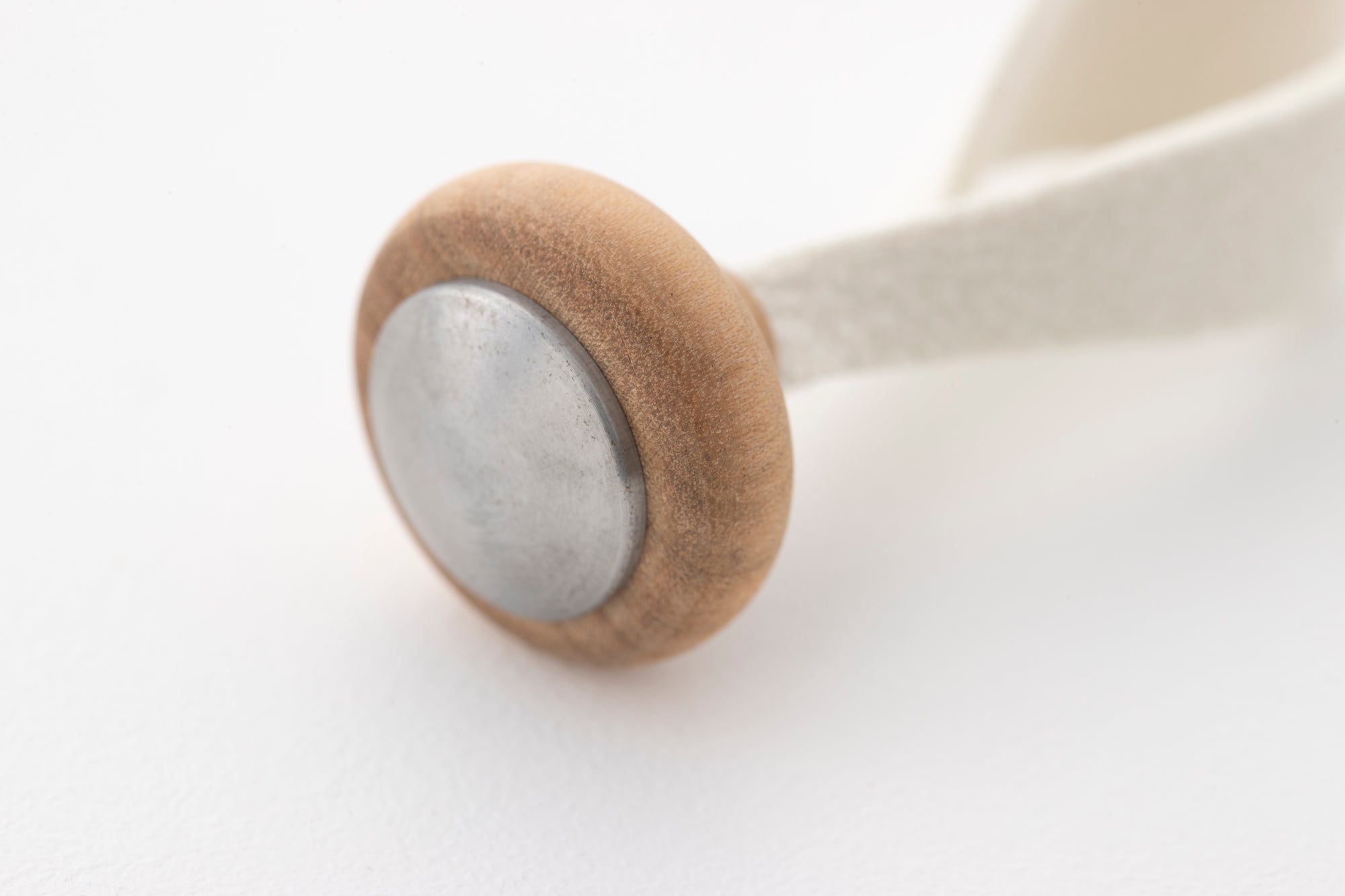 Close-up detail of the Tailo wooden mallet handle showing high-quality craftsmanship